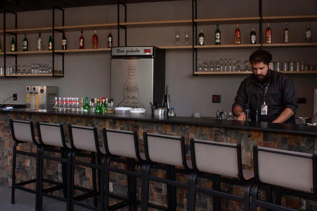 A luxurious spa room with a large jacuzzi and a view of the mountains